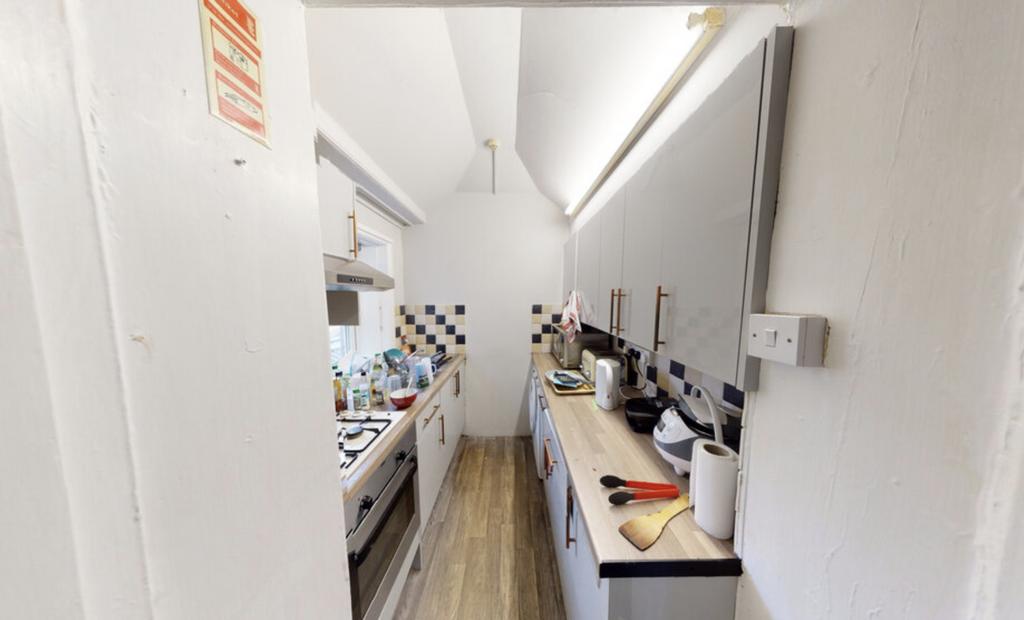 A well-maintained kitchen with ample workspace ...