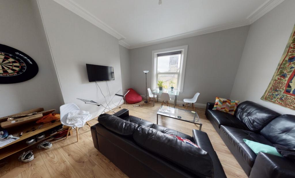 A modern and comfortable living room with ample...