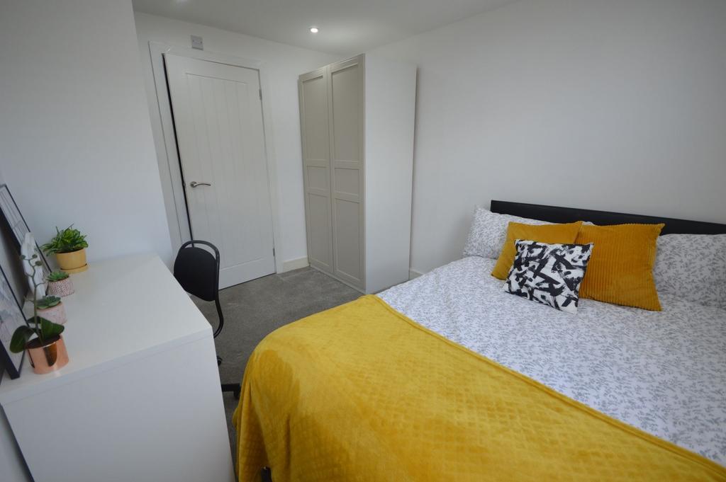 Bright and inviting double bedroom with contemp...