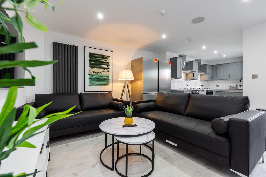 Modern and stylish living room featuring two sp...