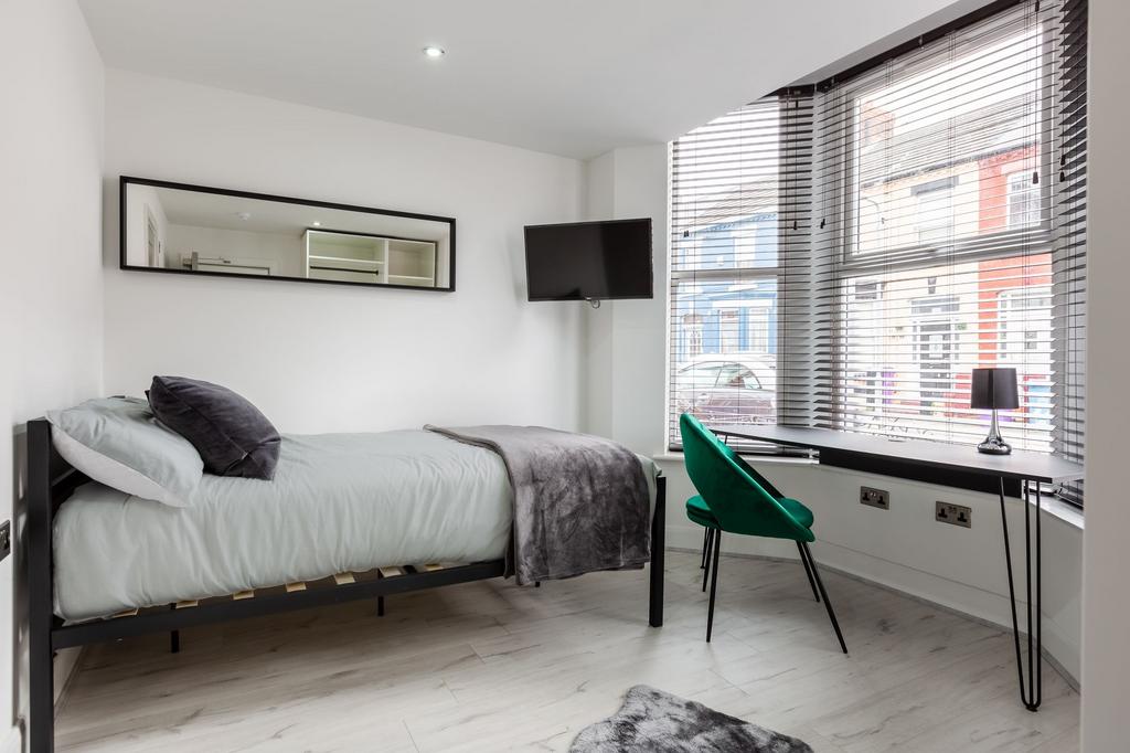 Bright and modern double bedroom featuring a ne...