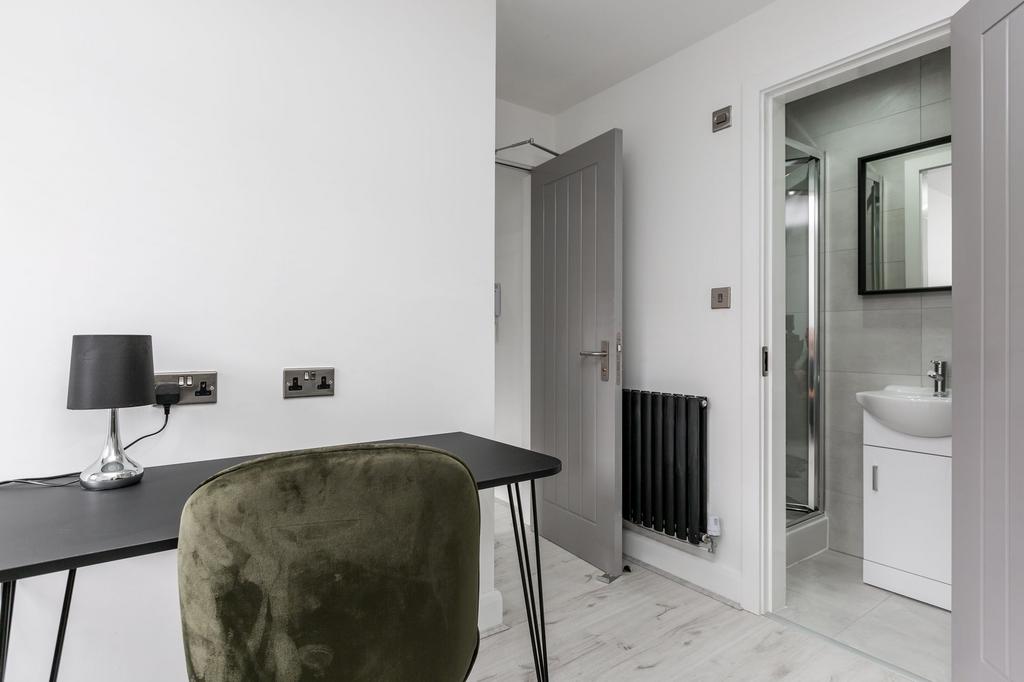 Modern and bright bathroom featuring a sleek wh...