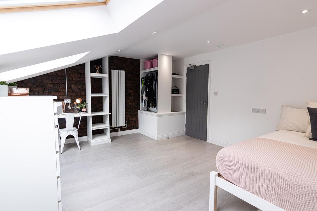 Bright, modern loft double bedroom with vaulted...