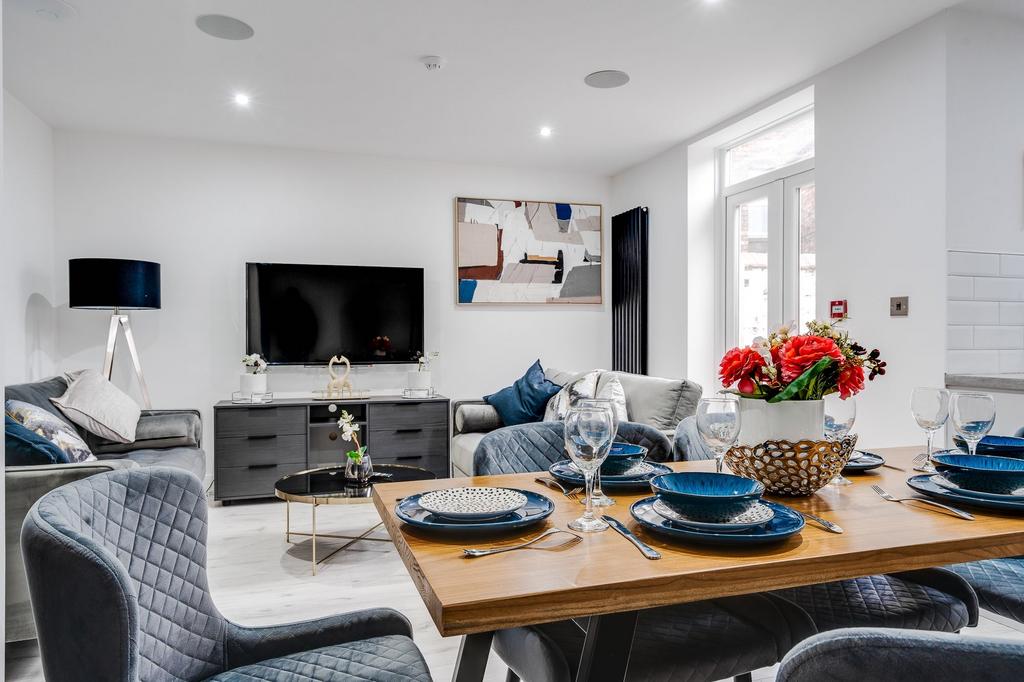 A modern and spacious living room featuring con...