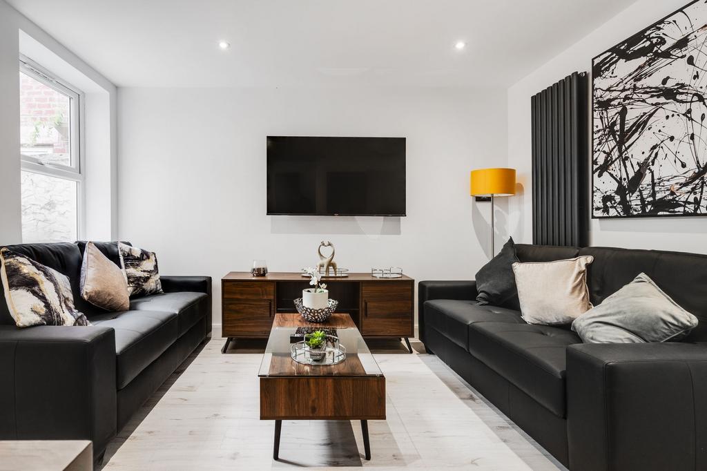 Modern and stylish living room featuring two bl...