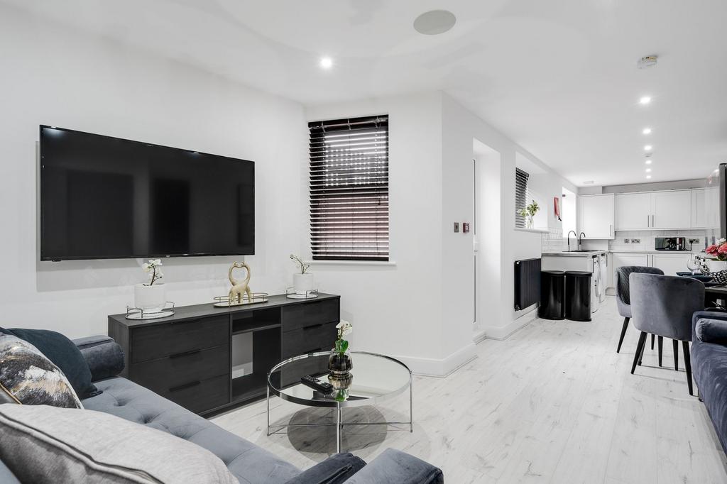 Modern and welcoming living room featuring a la...