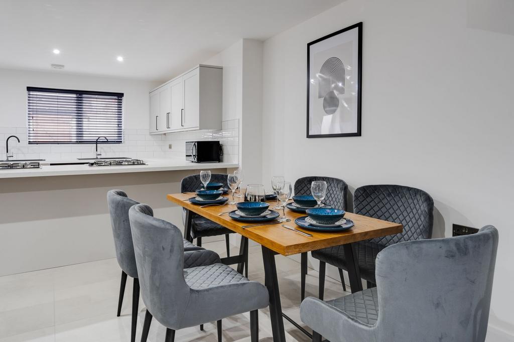 Modern, bright living room with a large window,...