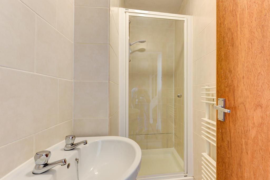 A clean and well-maintained bathroom with brigh...