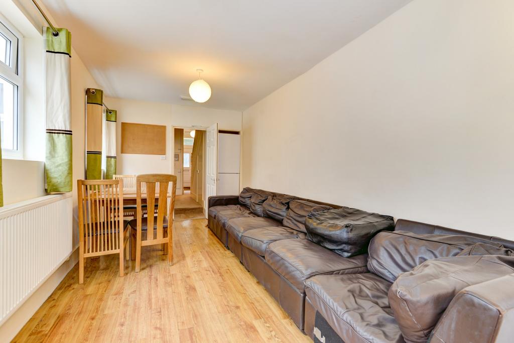 A welcoming living room featuring a large, comf...