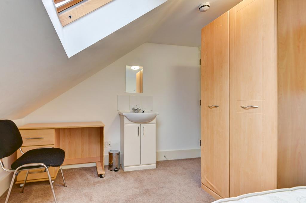 A clean and well-maintained bedroom with a simp...