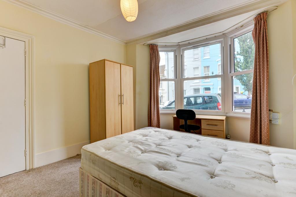 A welcoming double bedroom featuring a comforta...