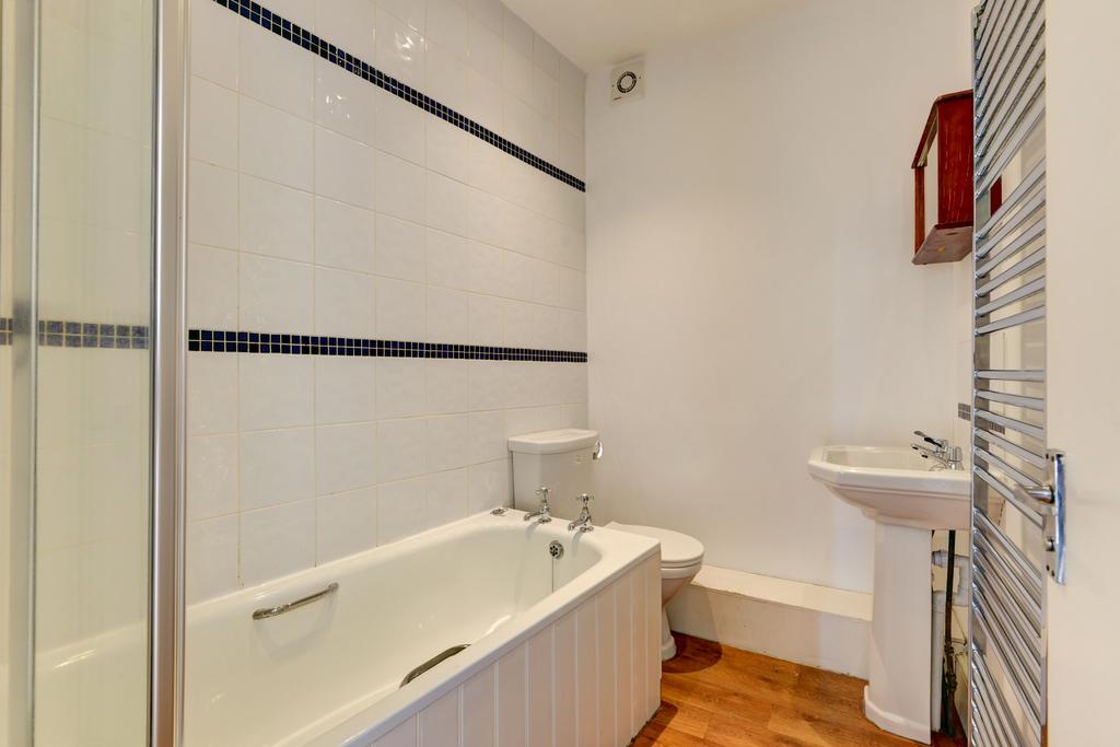 A clean and well-maintained bathroom featuring ...