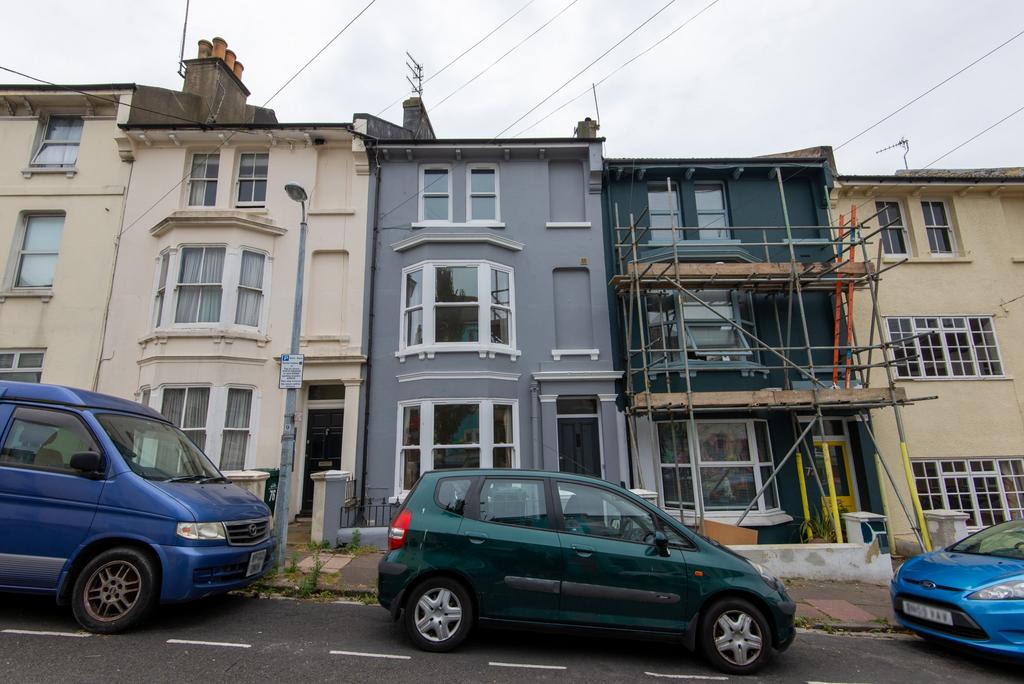 A charming exterior shot of a residential prope...
