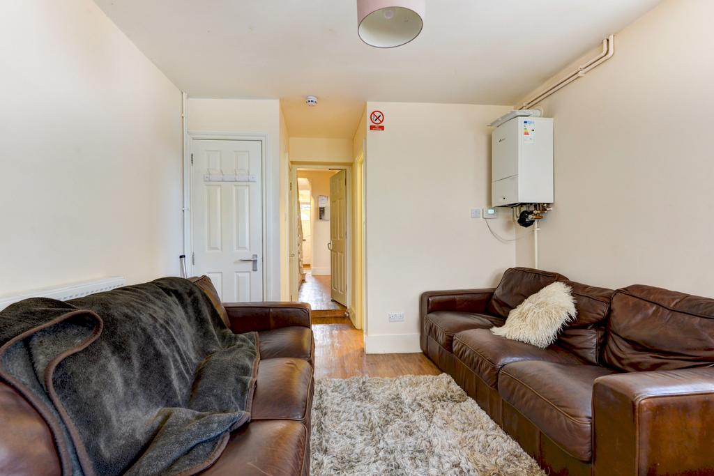 A spacious and inviting living room featuring c...