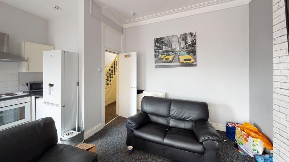 Bright and modern living room featuring comfort...