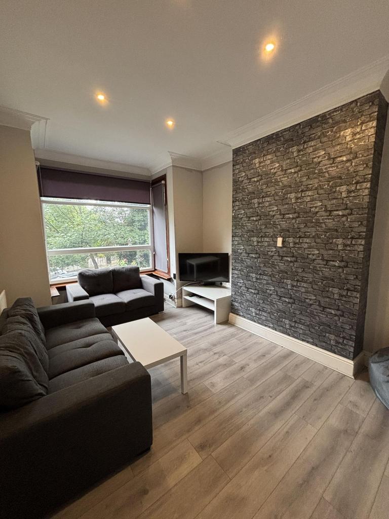 A modern and inviting living room featuring com...