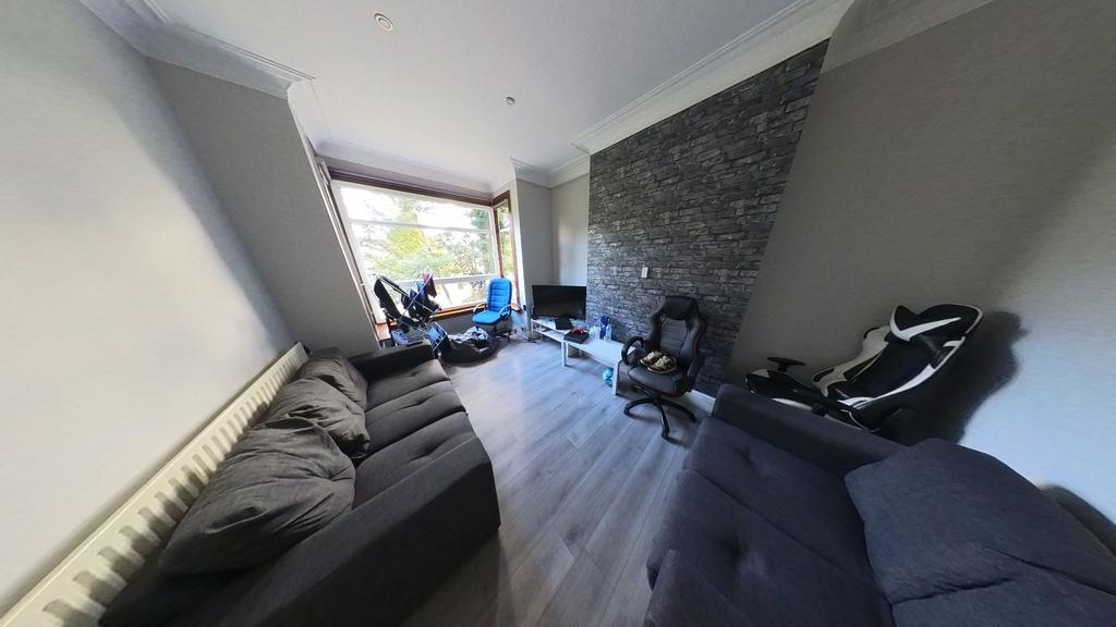 A spacious and well-lit living room featuring m...