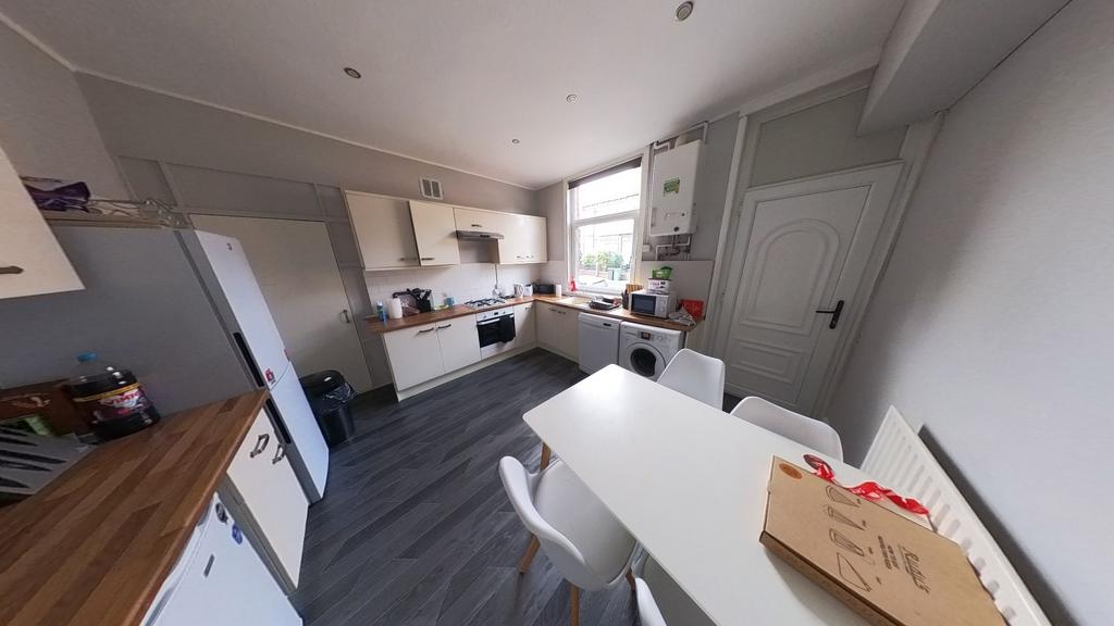 Bright and modern kitchen with ample natural li...