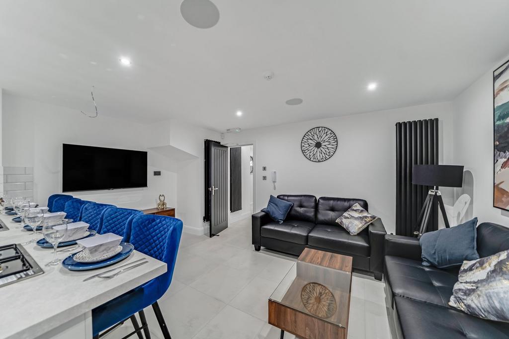 Modern and spacious living room featuring sleek...