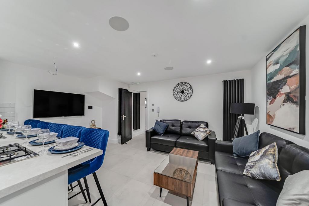 Bright and stylish living room featuring modern...