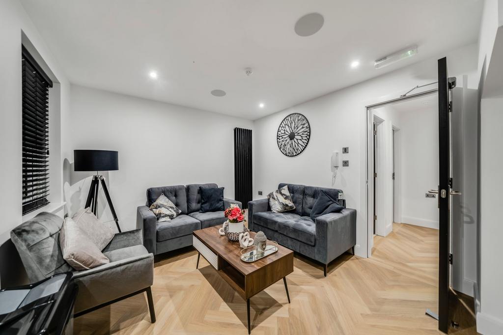 Bright and modern living room with three comfor...