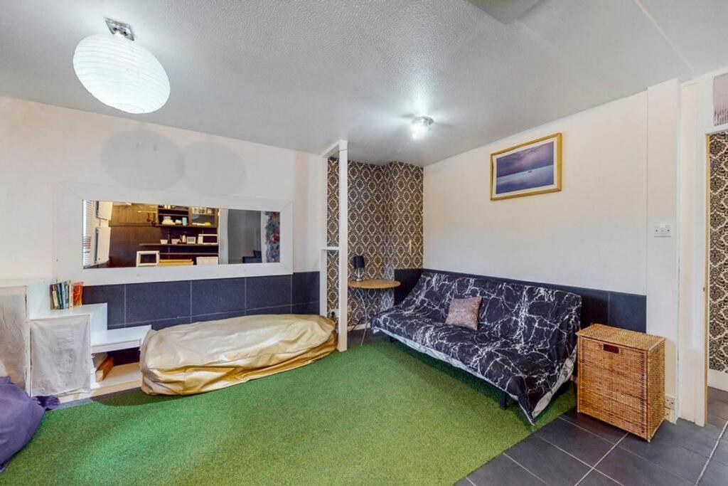 A cozy living room with a comfortable sofa and ...