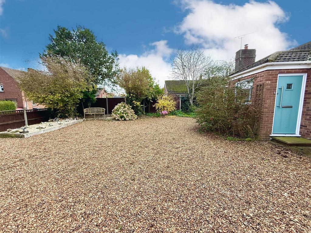 Drive and garden to front