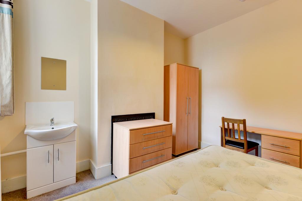 A spacious and well-maintained master bedroom f...