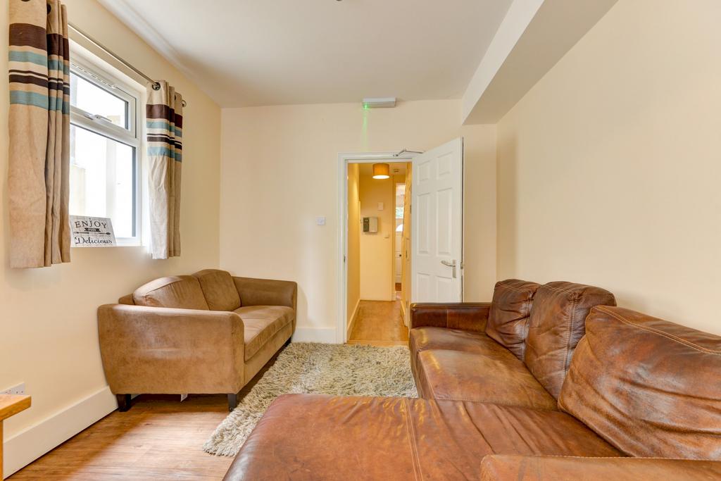 A spacious and well-maintained living room feat...