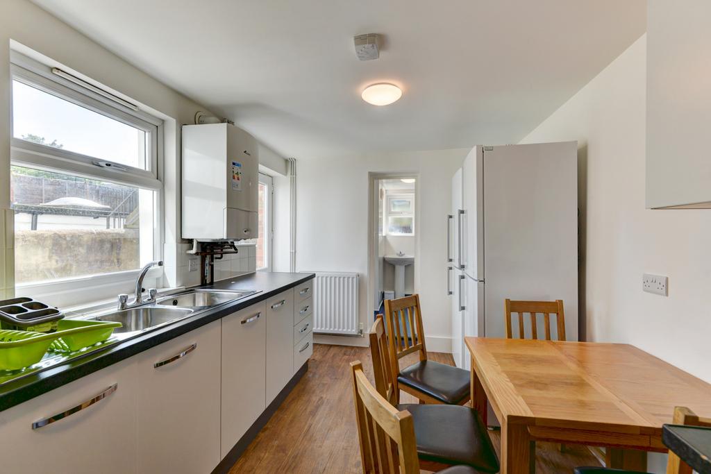 Bright and well-maintained kitchen with ample n...