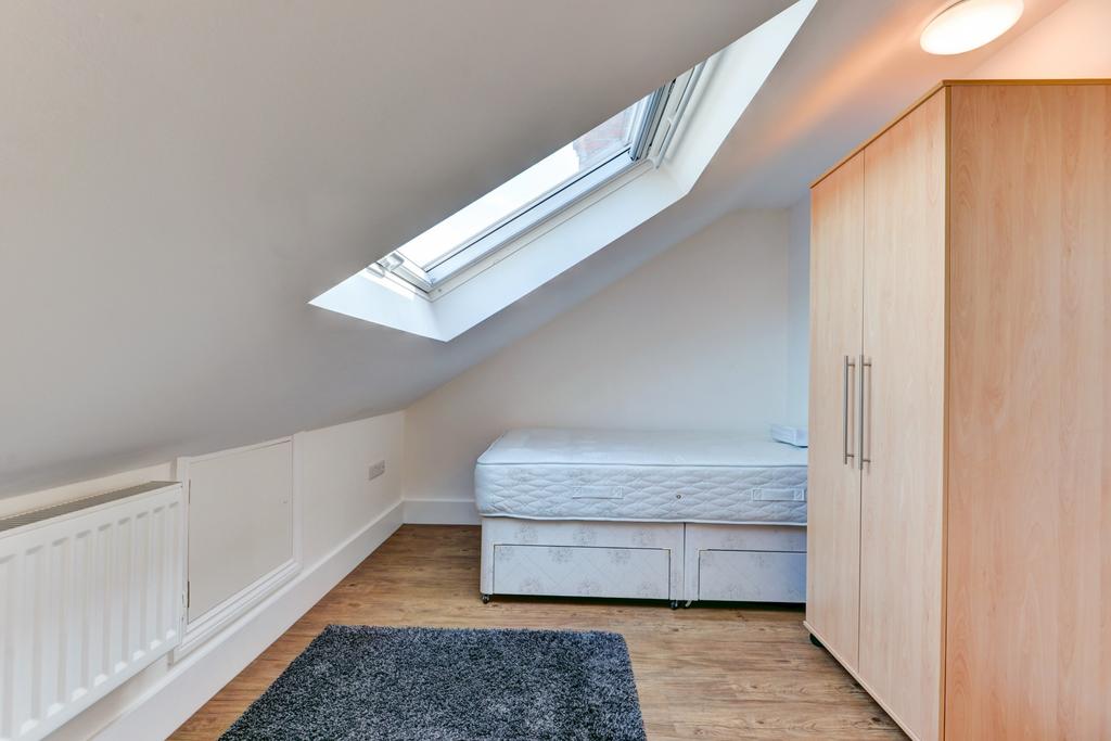 A simple and functional bathroom featuring a WC...