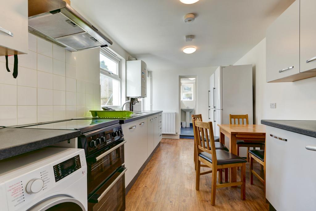 Bright and well-maintained kitchen with ample n...