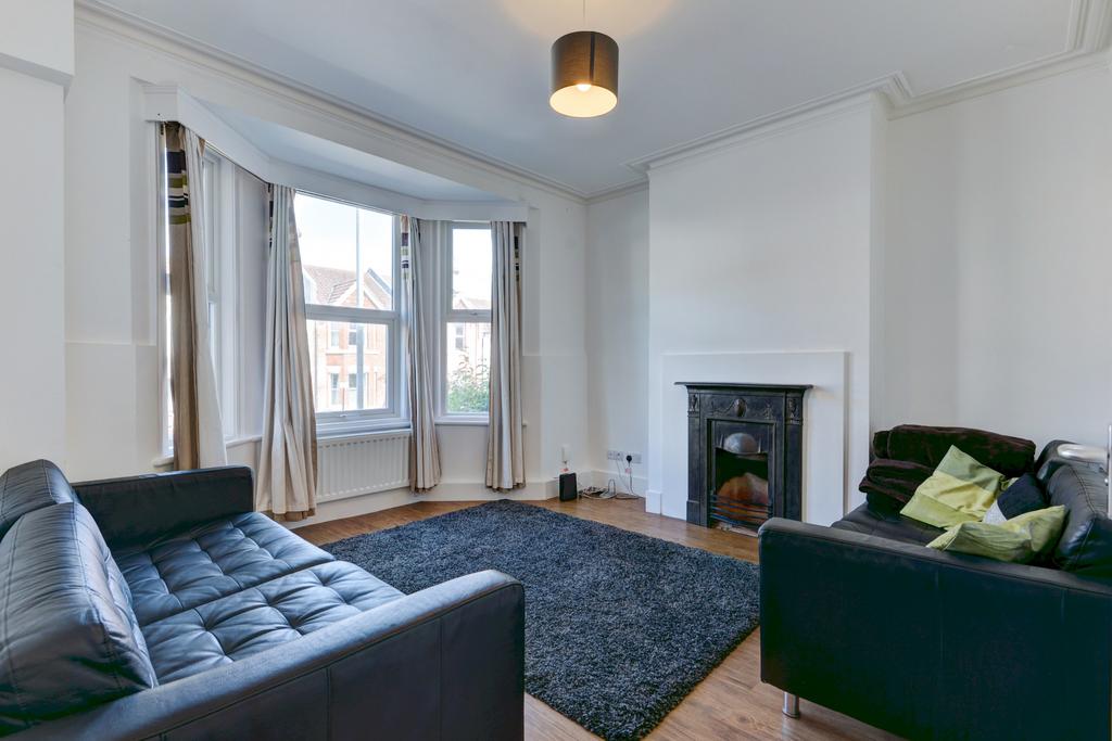 A spacious and well-lit living room featuring l...