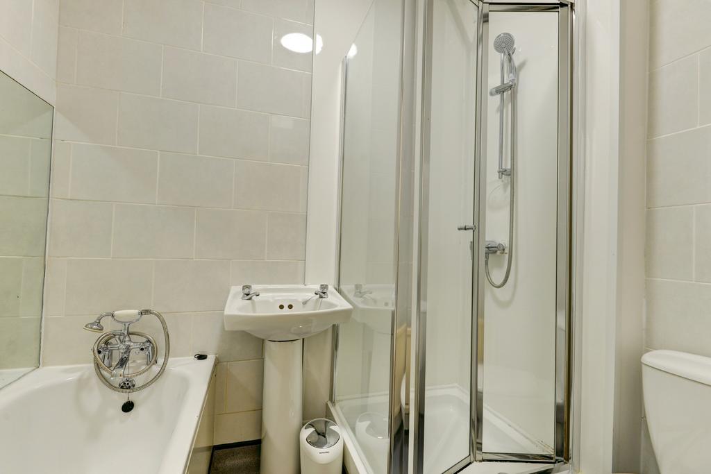 A clean, well-maintained bathroom with a bathtu...