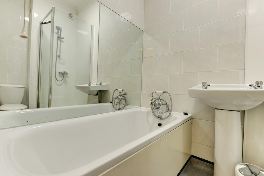 A clean and well-maintained bathroom with a spa...