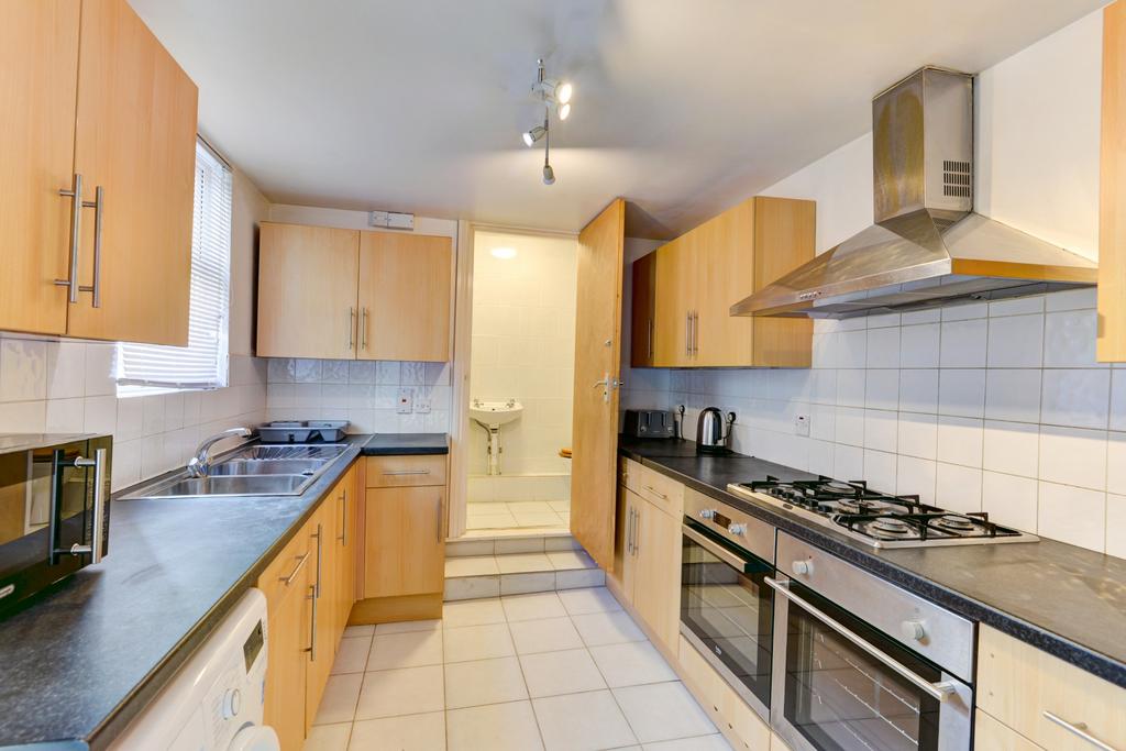 A bright and well-maintained kitchen featuring ...