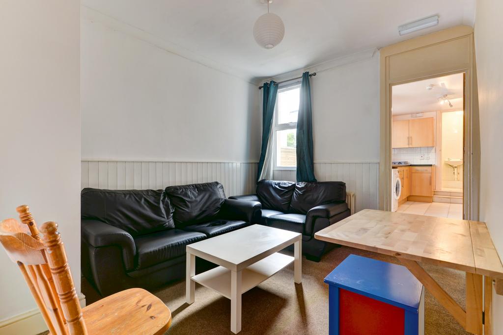 A cozy and well-maintained living room featurin...