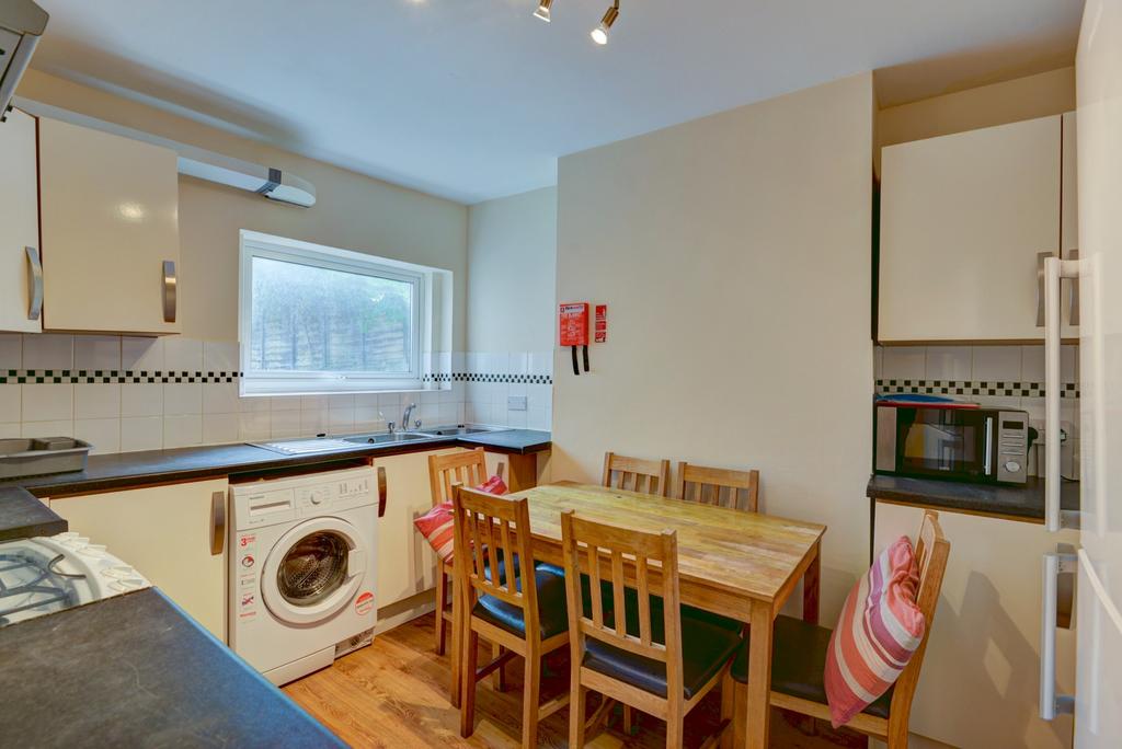 A bright and well-lit kitchen area featuring a ...