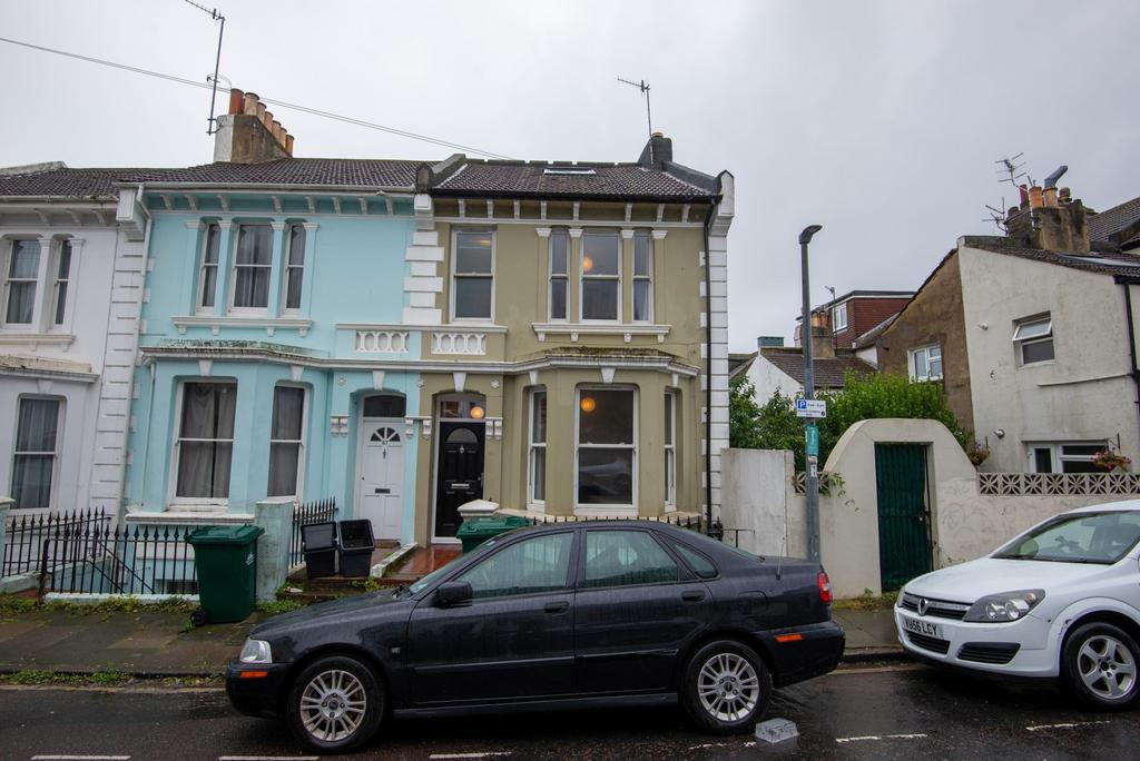 A street view featuring a row of terraced house...