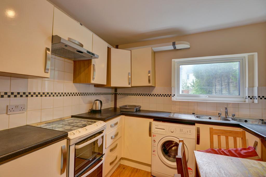 A well-maintained kitchen with ample counter sp...