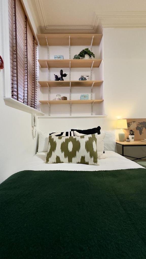 A stylish and inviting double bedroom featuring...
