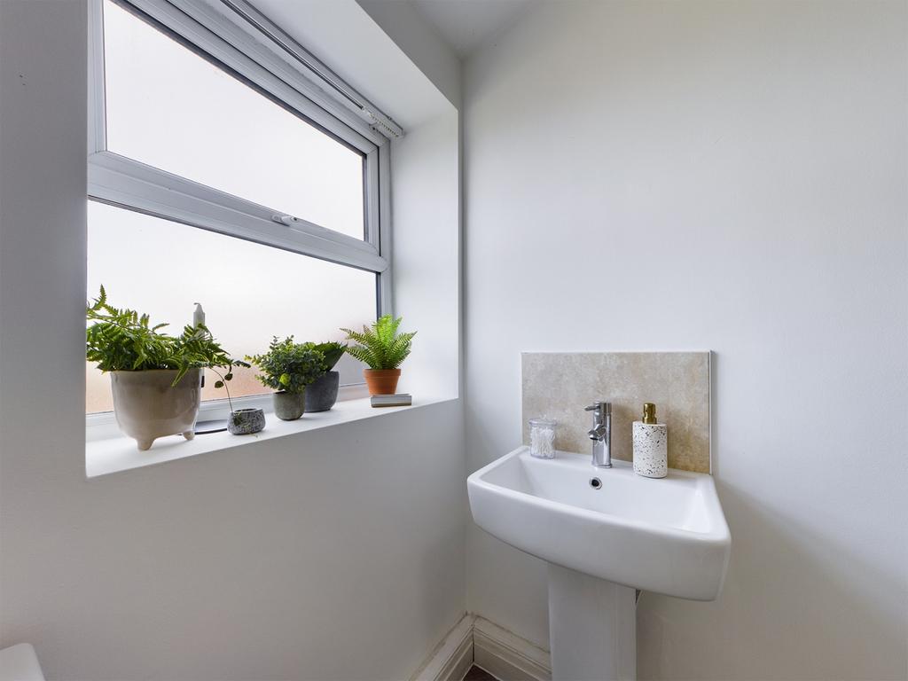 A bright and clean bathroom featuring a stylish...