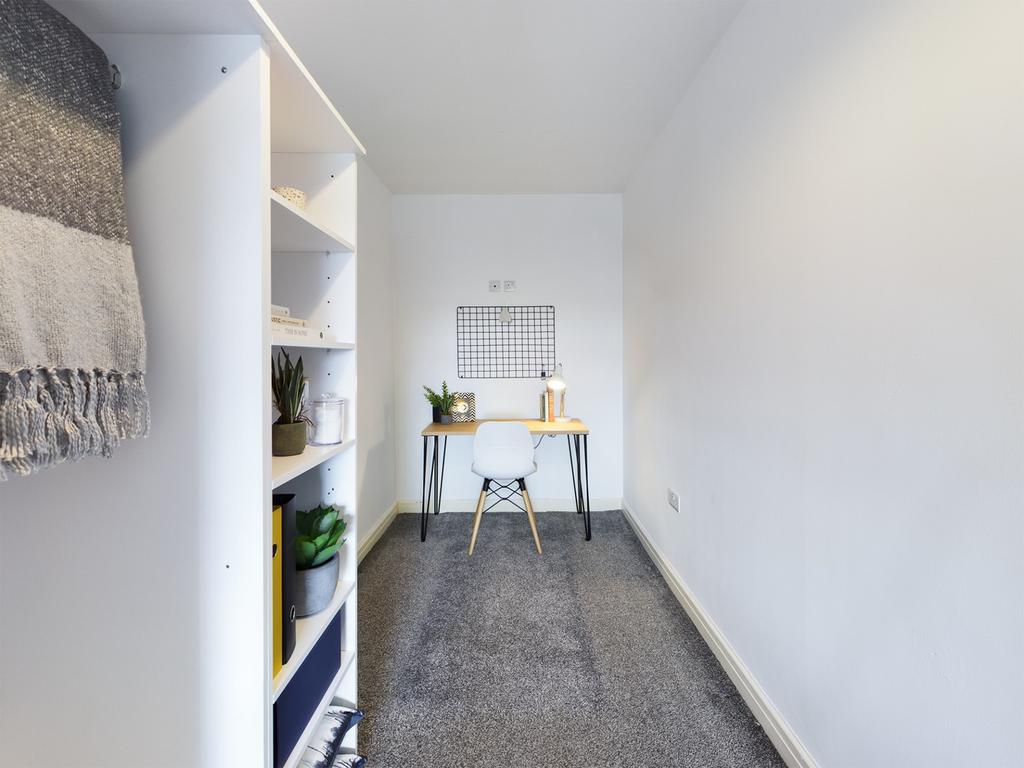 A bright and tidy communal workspace featuring ...