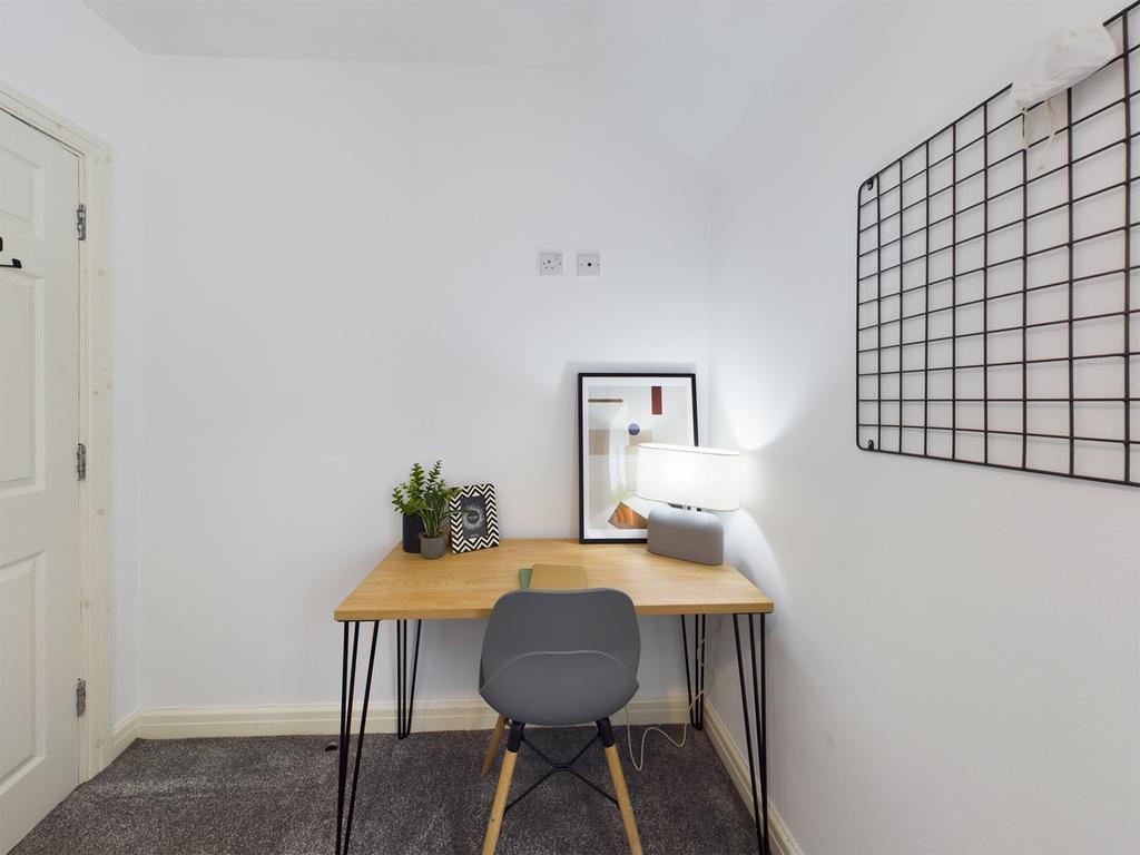 A bright and tidy communal workspace featuring ...