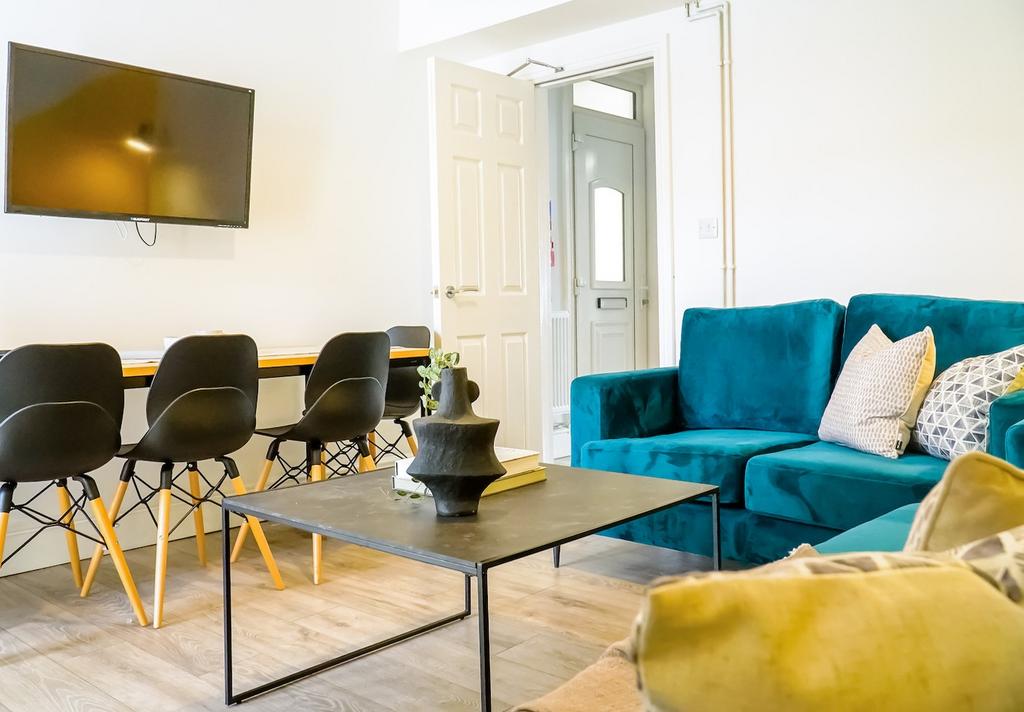 A bright and spacious modern living room featur...