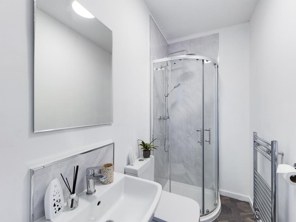 A modern and clean bathroom featuring a stylish...