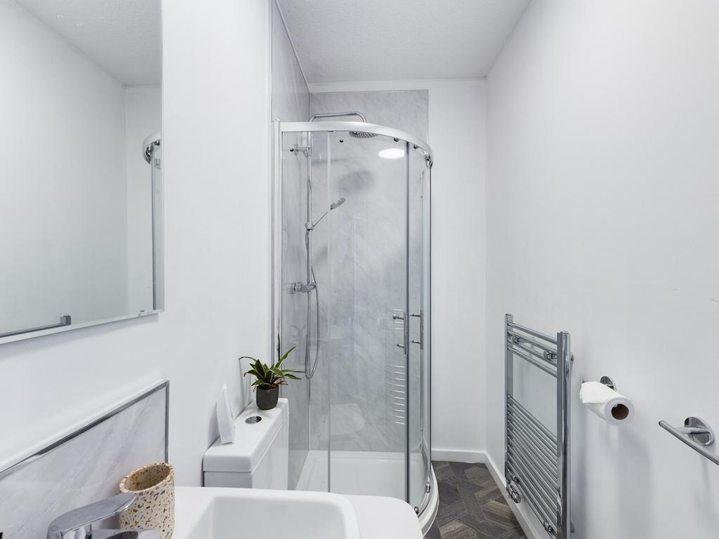 A modern and clean bathroom featuring a stylish...