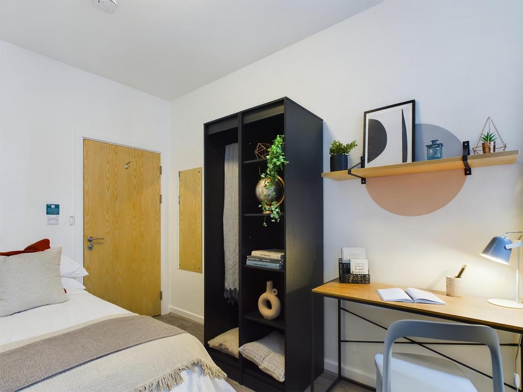 A stylish and inviting double bedroom with mode...