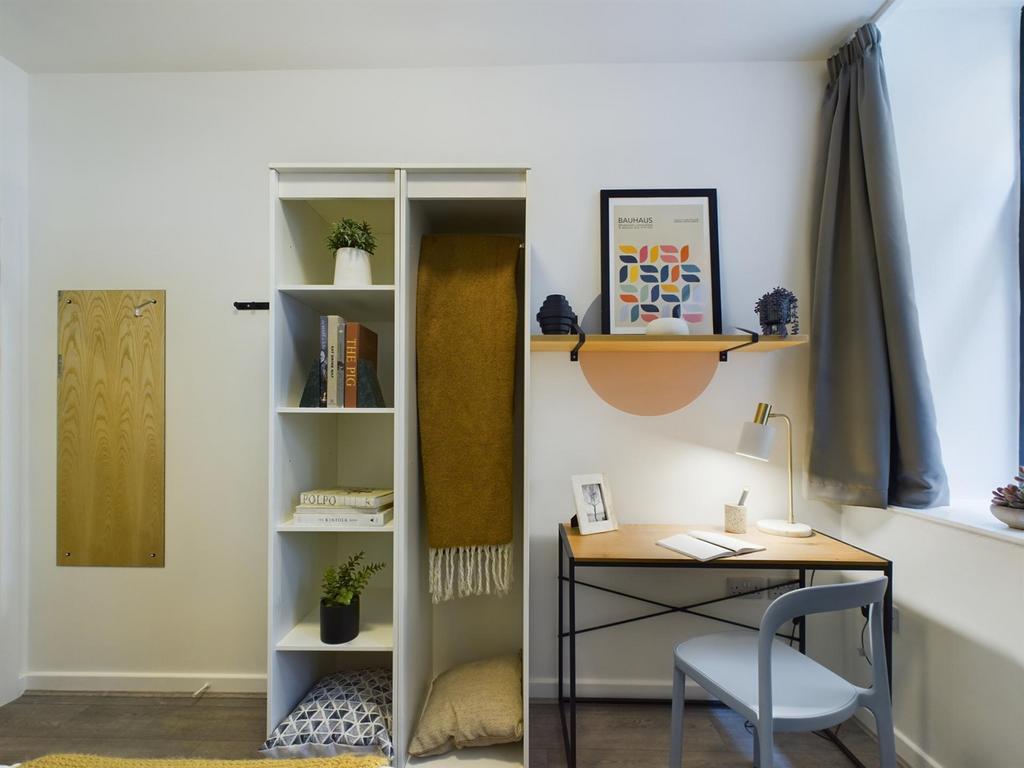 A stylish and well-organized double bedroom fea...