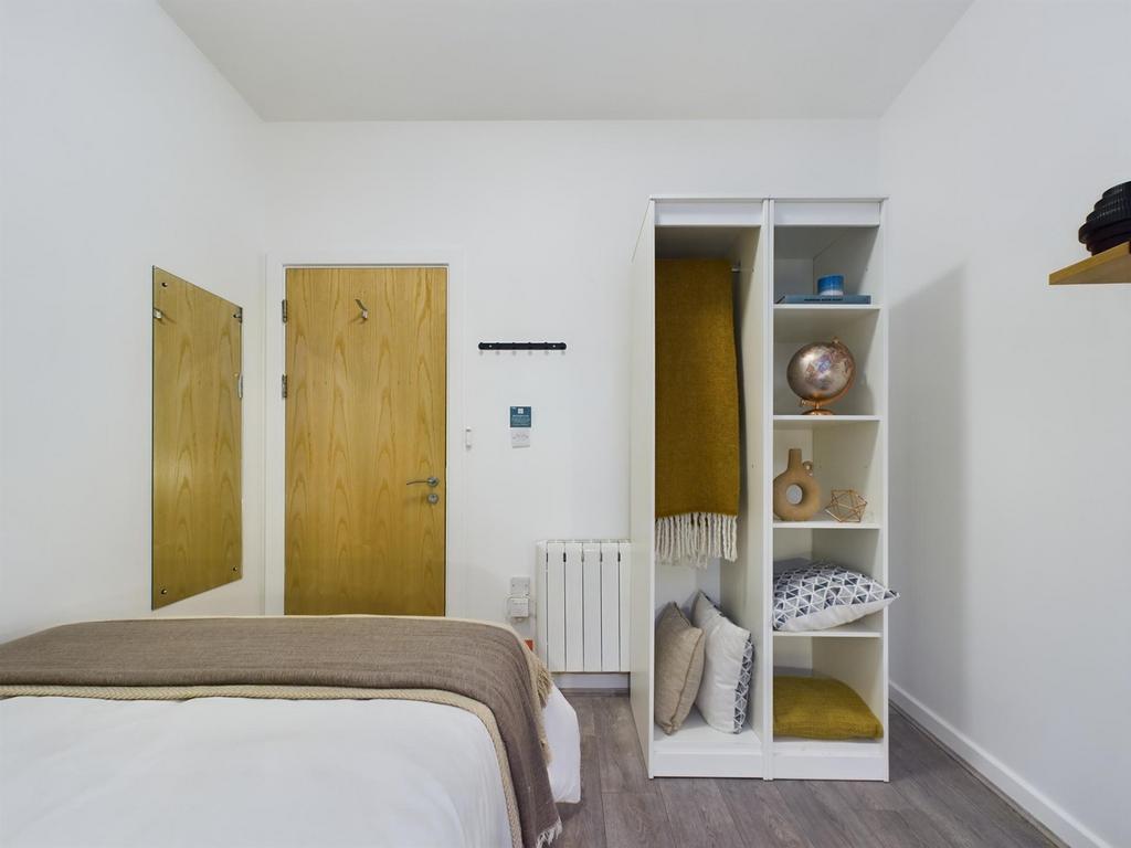 A stylish and inviting double bedroom, featurin...
